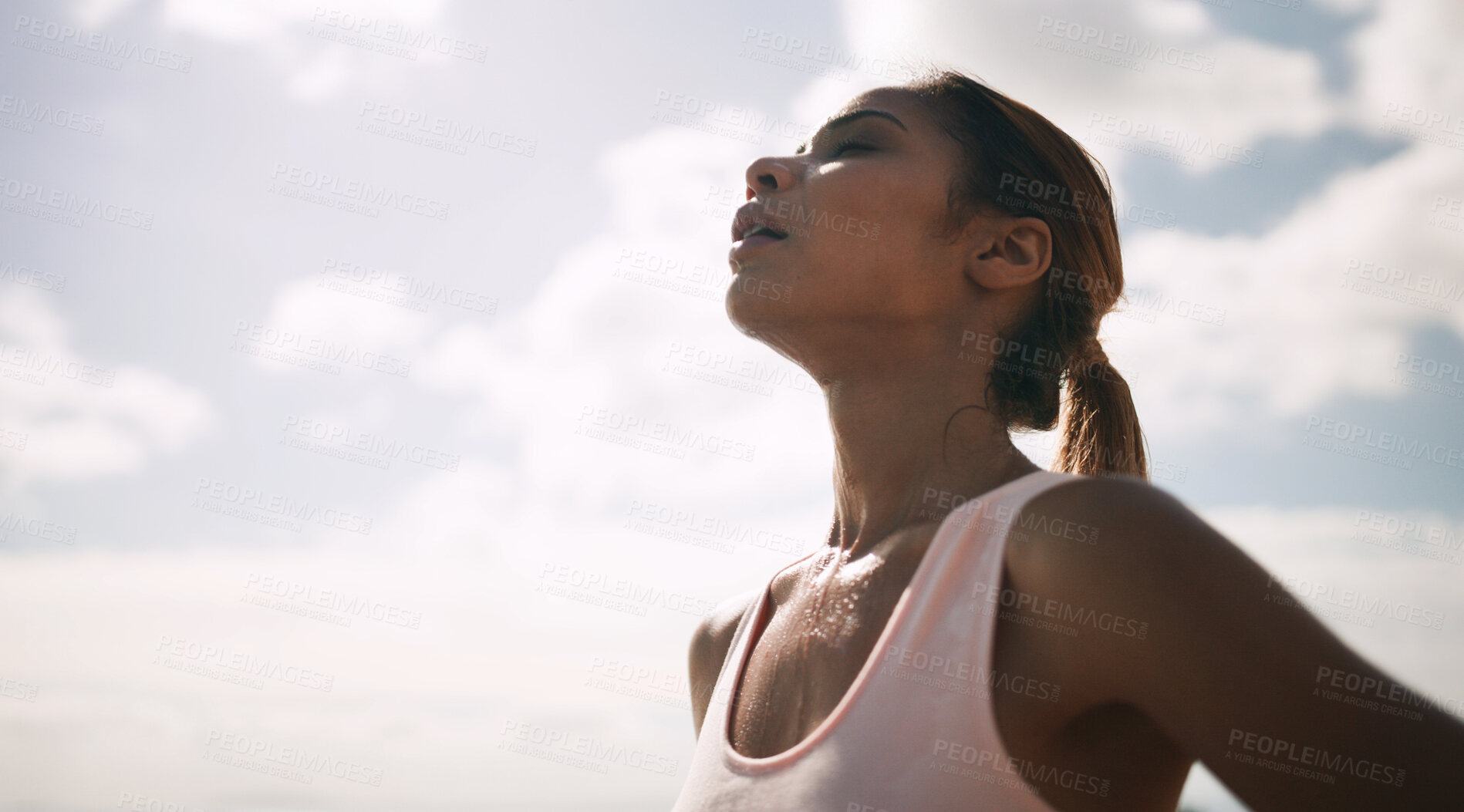 Buy stock photo Outdoor, woman and running break with sweat or breathe for fitness, health and self care. Female person, sky and tired or exhausted with jogging as workout, training and exercise for wellness