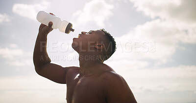 Buy stock photo Man, shirtless and outdoor athlete with bottle of water, hydration and sweating by sky. Male person, refreshing thirst and sports drink for nutrition in nature, topless and mineral liquid for fitness