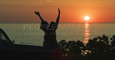 Buy stock photo Sunset, couple and freedom with travel by beach with hugging, holiday adventure or summer memory. Silhouette, lesbian people or view of ocean by car on weekend vacation, bonding together or road trip