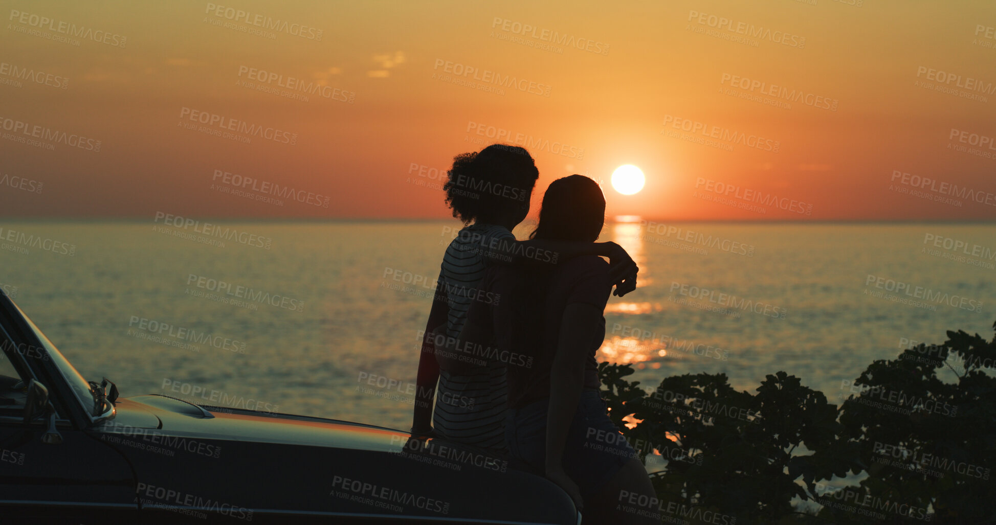 Buy stock photo Lesbian, couple and sunset at beach with silhouette for romance, hugging and adventure with car. Space, people and view of ocean on road trip, weekend vacation and bonding together with sightseeing