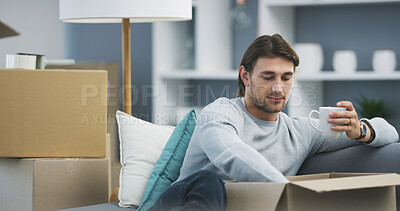 Buy stock photo Man, living room and coffee for boxes, packing and moving in new house as college student. Male person, cardboard and spring cleaning as social responsibility, outreach and donation with hot beverage