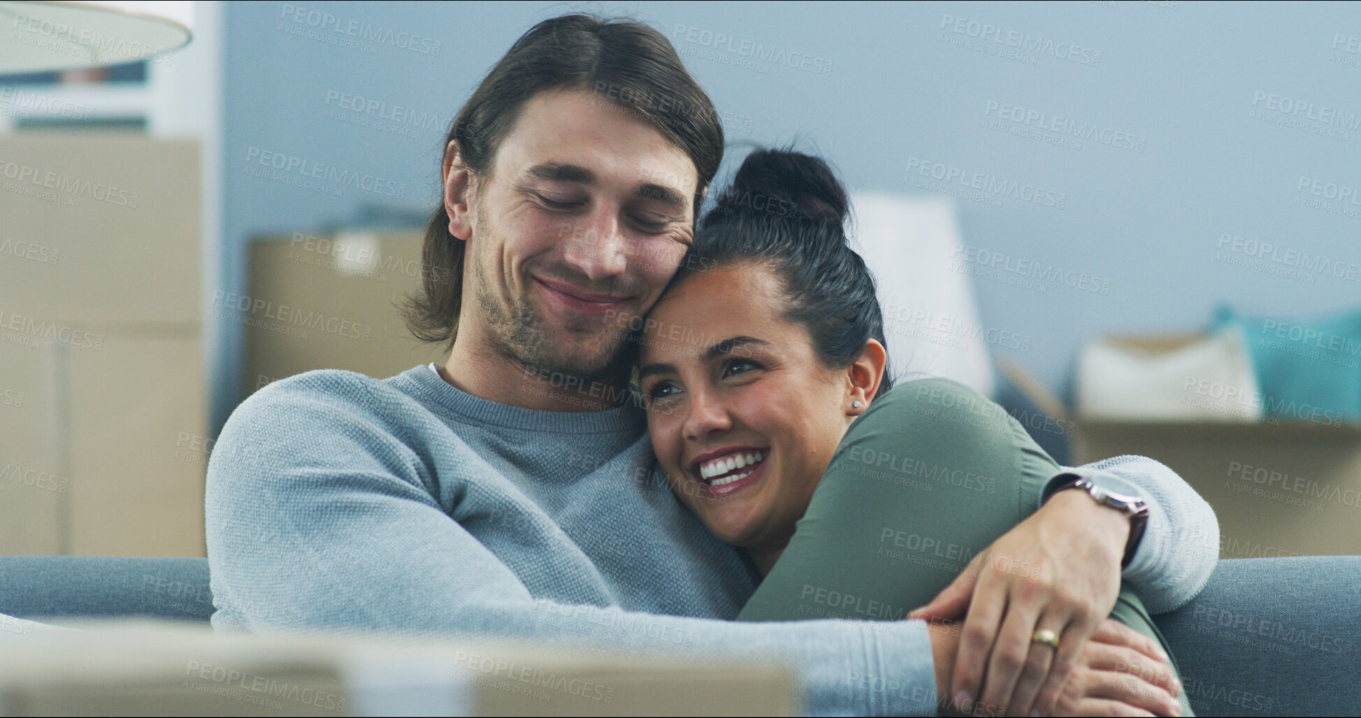 Buy stock photo Happy couple, hug and sofa in new home with love, support and pride for investment opportunity. Man, woman and relax on couch for moving in, relationship milestone and loan approval for apartment