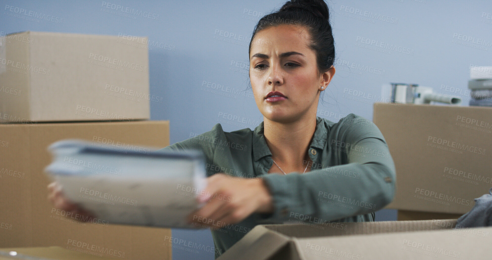 Buy stock photo Unboxing, house and woman with boxes, book and real estate with cardboard in lounge. Person, apartment and girl in living room, moving and new home with property, serious and novel with ownership