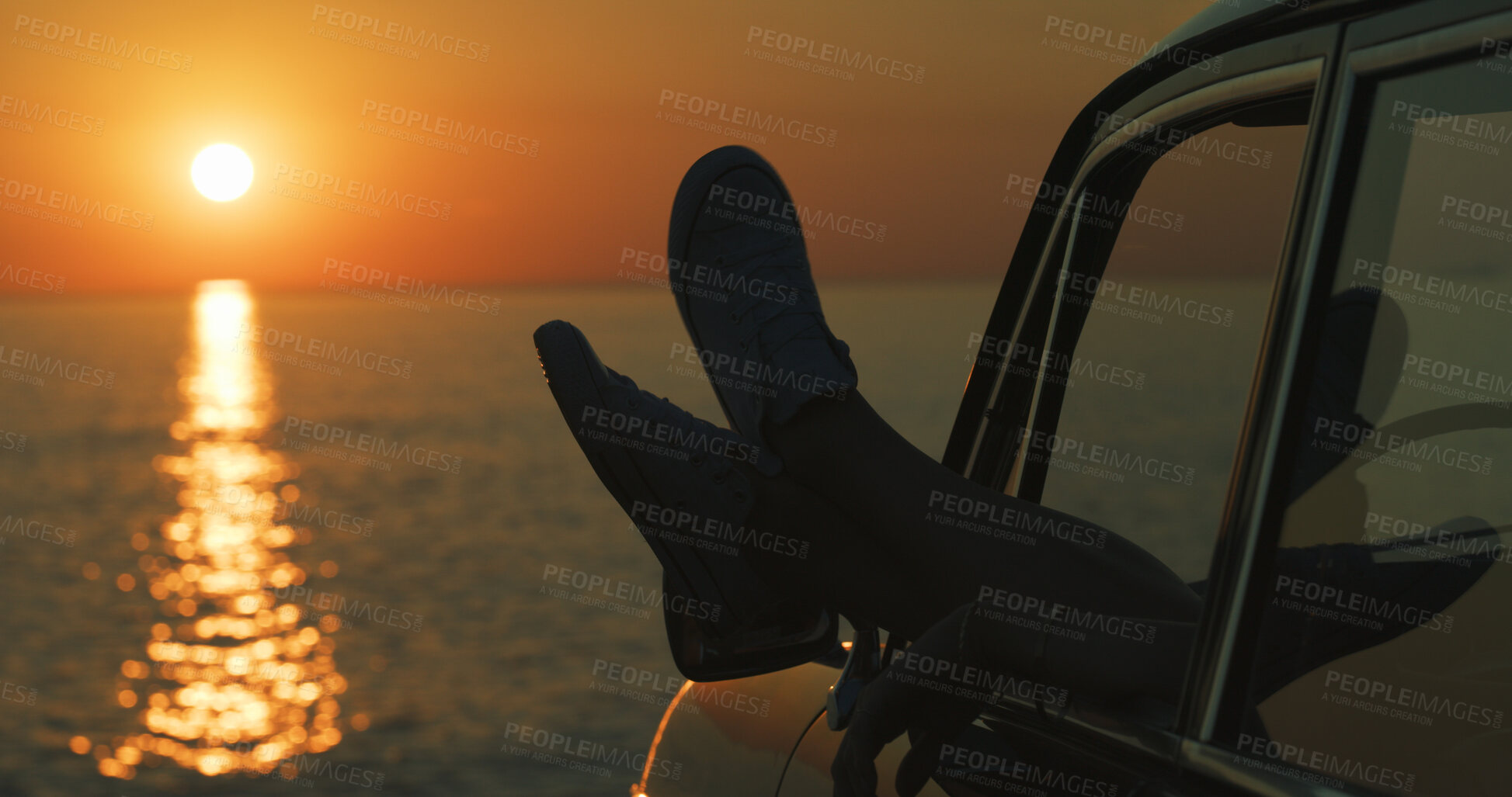 Buy stock photo Person, legs and shoes with car window or beach sunset for road trip, holiday or vacation by ocean coast in nature. Driver, feet and relax with view in vehicle for transport, travel or tourism by sea