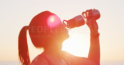 Buy stock photo Woman, fitness and drinking water with beach sunset for hydration, mineral liquid or refreshment. Active, female person or runner with lens flare, aqua beverage or thirst for natural sustainability