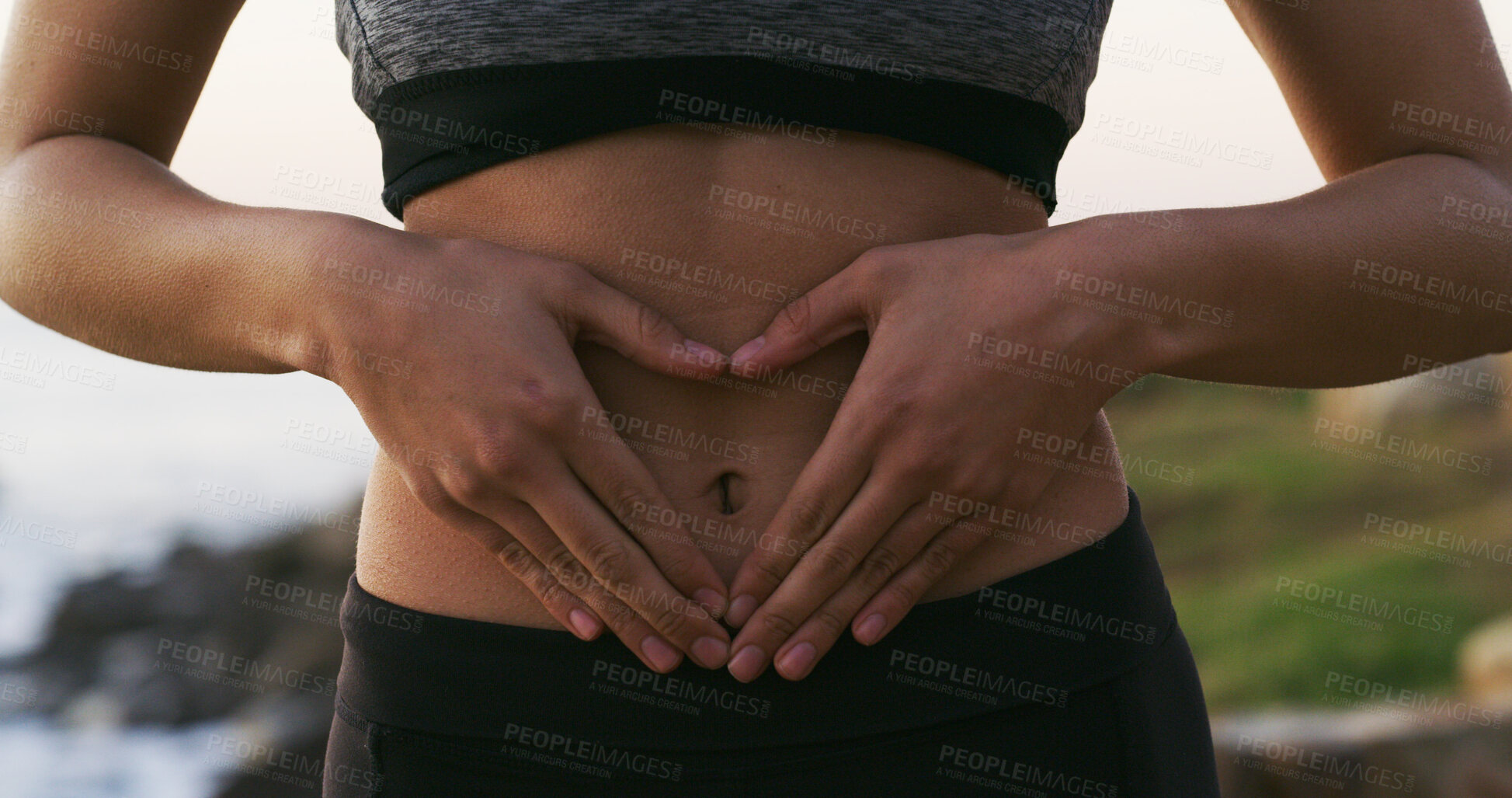 Buy stock photo Woman, hands and balance with stomach for gut health, fitness or belly wellness in nature. Closeup, female person or tummy with good digestion for healthcare, training or workout by beach or ocean