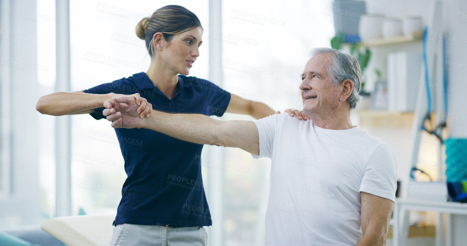 Buy stock photo Physiotherapy, woman or elderly patient with shoulder pain for stretching, help or care in office. Chiropractor, senior man or support in practice for rehabilitation, healing or arm exercise in exam