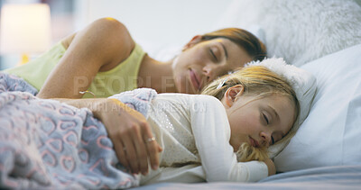 Buy stock photo Mother, daughter and sleeping together in bedroom, peace and support in dream of family home. Mommy, girl and late weekend morning with child for nap, relax and embrace security in relationship