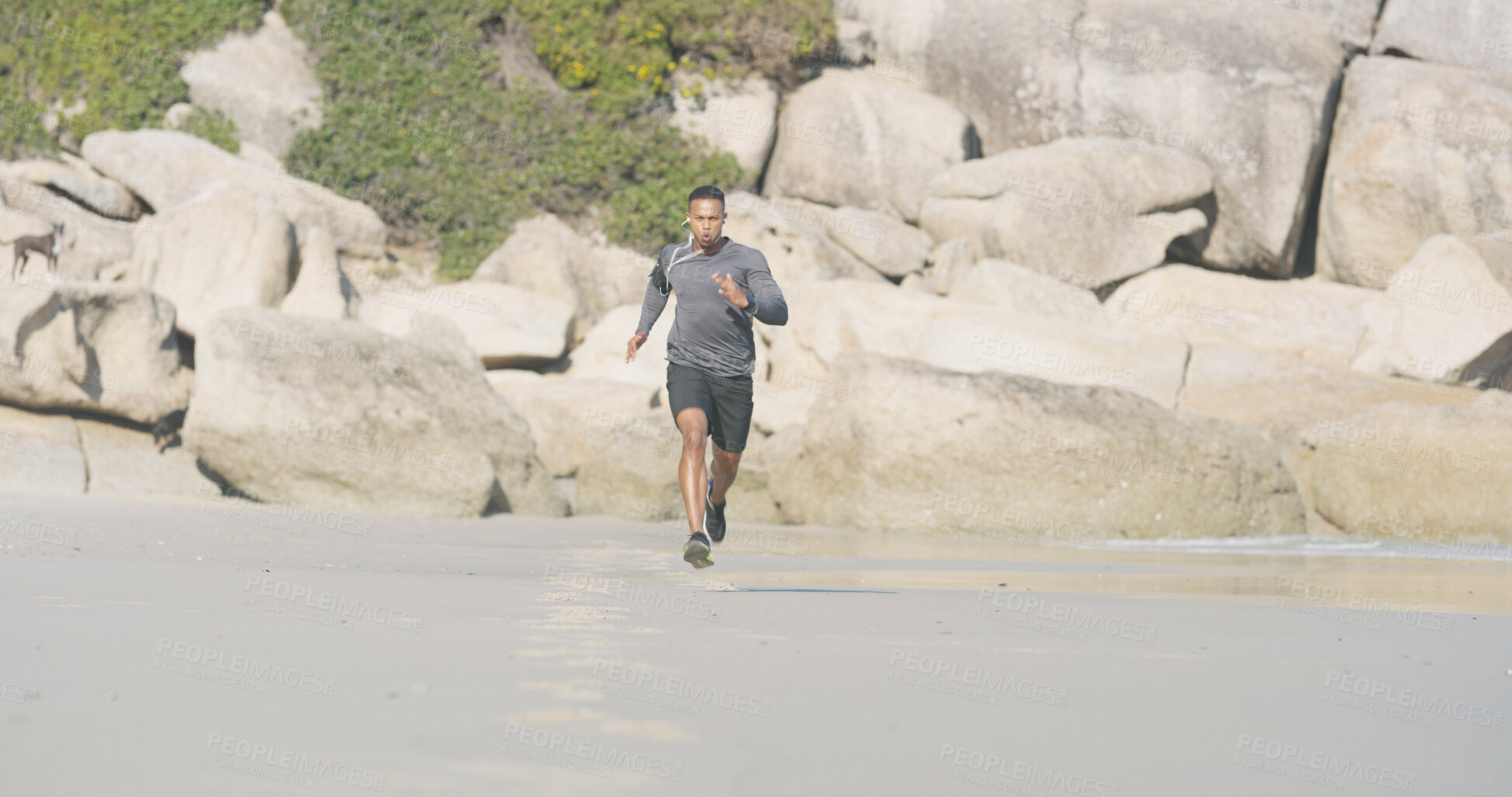 Buy stock photo Beach, man and portrait with running for fitness, exercise and sprinter with pace for wellness outdoor. Ocean, male person and runner with speed for training, cardio and preparation for marathon race