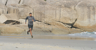 Buy stock photo Beach, man and speed with running for fitness, exercise and sprinter with pace for wellness outdoor. Ocean, male person and runner with music for training, cardio and prepare for marathon challenge