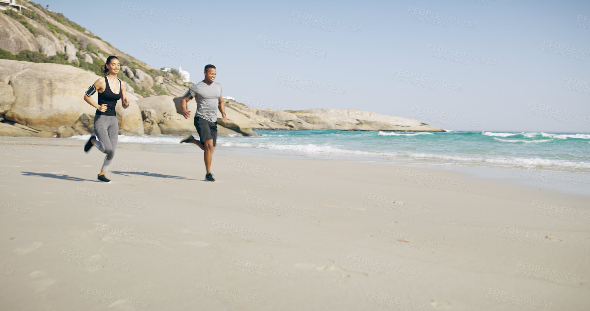 Buy stock photo Beach, couple and happy with running for fitness, exercise and energy with cardio for challenge goal. Ocean, man and woman with smile for marathon training, wellness and bonding together by mockup