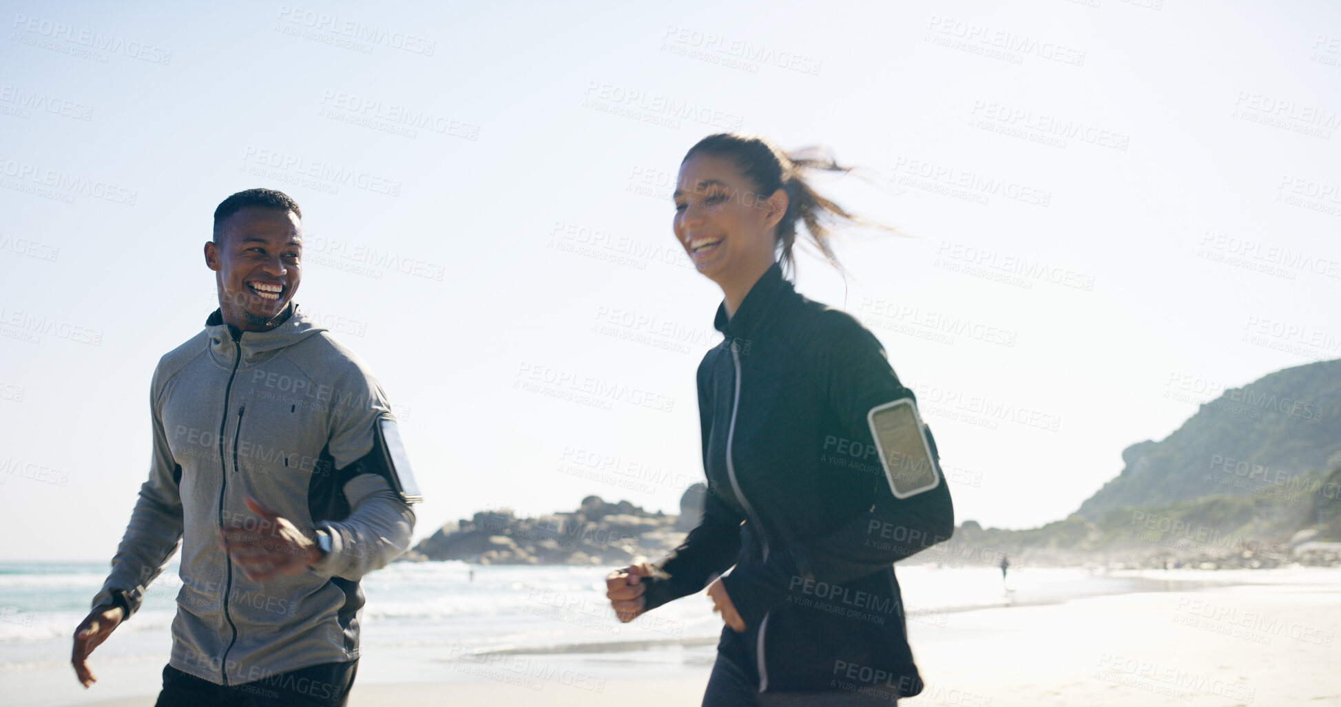 Buy stock photo Beach, couple and smile with running for fitness, exercise and energy with cardio for challenge goal. Happy, man and woman by ocean for marathon training, wellness pace or bonding together by seaside