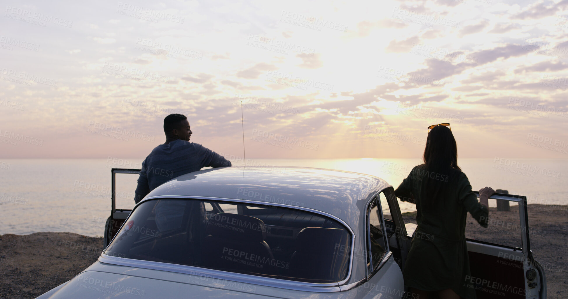 Buy stock photo Car, beach and couple on road trip at sunset with sky, romantic date and holiday adventure together. Nature, man and woman on travel vacation with love, view and outdoor journey at ocean from back