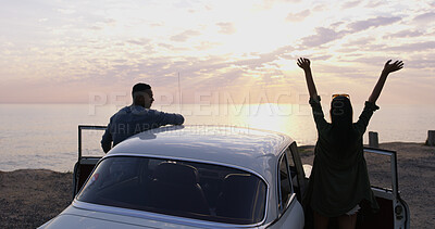 Buy stock photo Road trip, sunset and freedom with couple at beach for ocean view, summer vacation and adventure. Love, holiday and tourist with back of people and car in nature for relax, transportation and drive