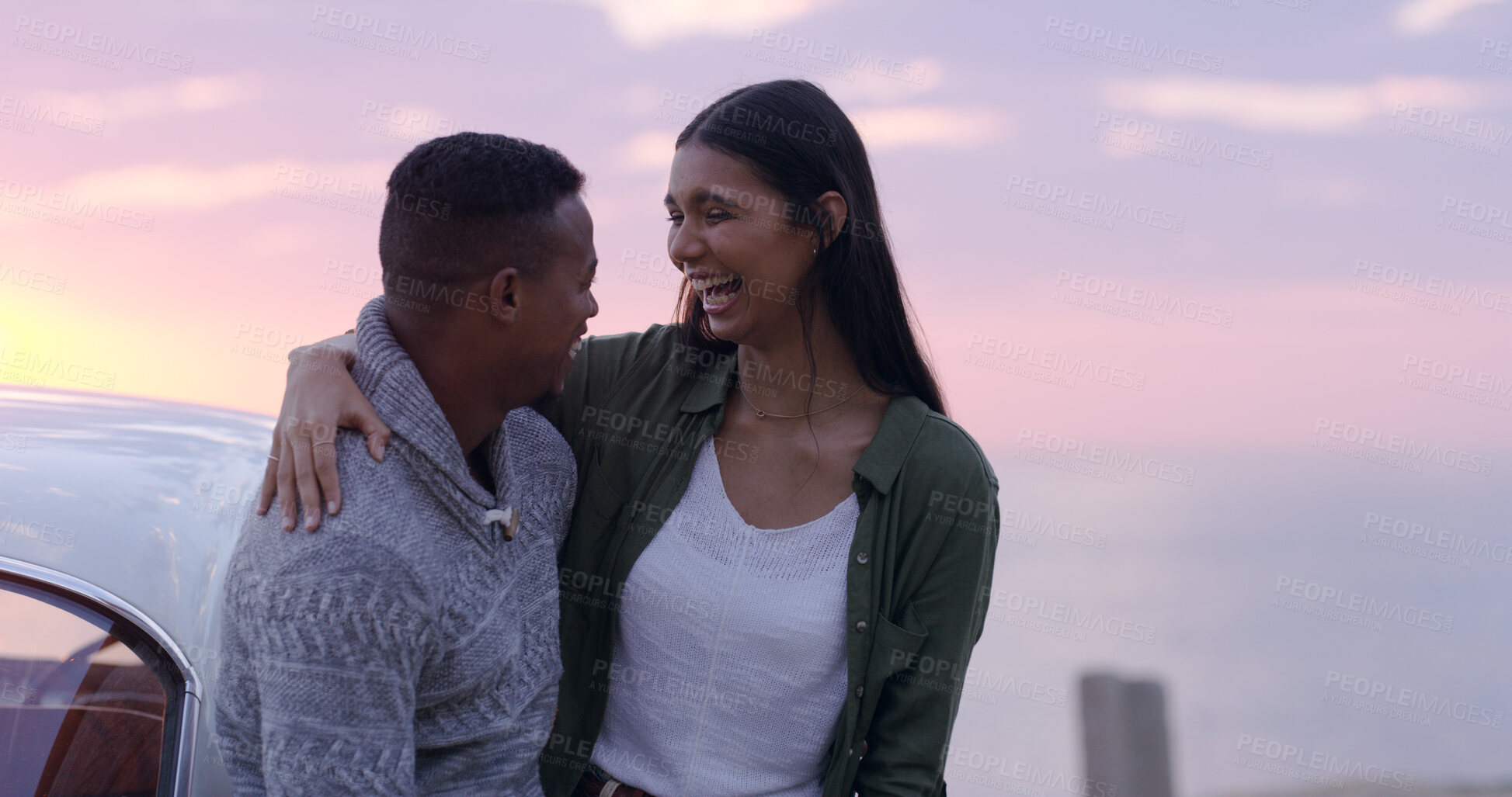 Buy stock photo Sunset, beach and couple embrace on road trip, romantic date or happy holiday adventure together. Evening sky, man and woman at car on travel vacation with love, laughing or outdoor journey at ocean