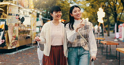 Buy stock photo Travel, tourist and women in market, pointing and journey for tourism, together and friendship in Tokyo. Outdoor, trip and people on vacation, exploring and shopping for traveller, holiday and Japan