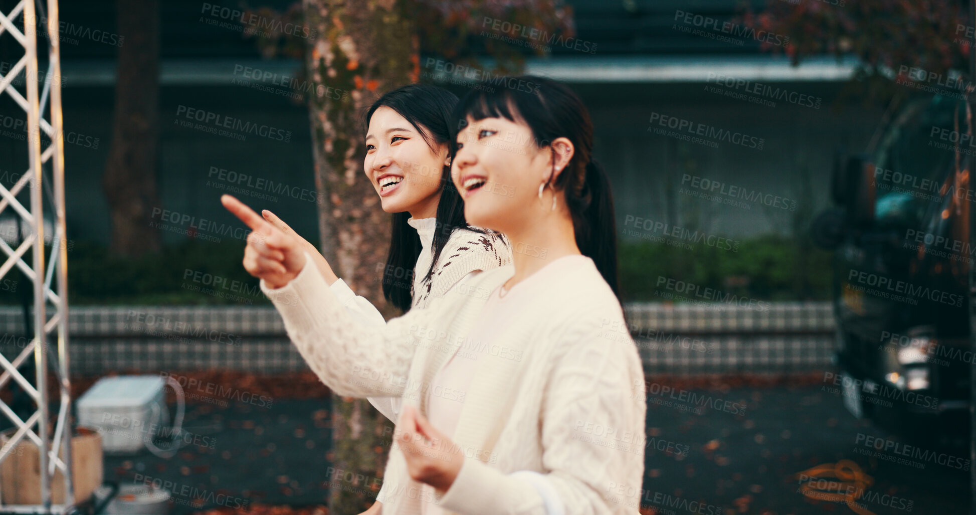 Buy stock photo Travel, pointing and Asian women in city, tourism and bonding with vacation, smile and sightseeing. Outdoor, friends and Japanese people on holiday, tourist and happy for trip, relationship and Japan