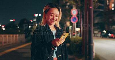 Buy stock photo Night, waiting and woman at in city with phone, happy travel and checking online public transport schedule. Smartphone, search and Japanese girl in street with smile, mobile app and urban commute