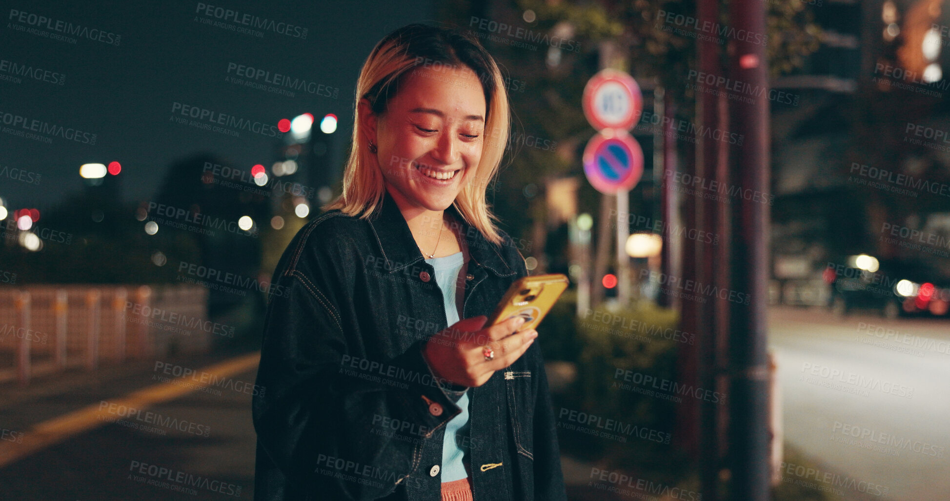 Buy stock photo Night, waiting and woman at in city with phone, happy travel and checking online public transport schedule. Smartphone, search and Japanese girl in street with smile, mobile app and urban commute