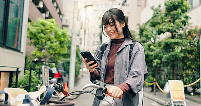 Buy stock photo Phone, bicycle and happy with Japanese woman in city for location, digital map and travel. Social media, cycling and mobile app with person and bike in Japan for networking, connection and adventure