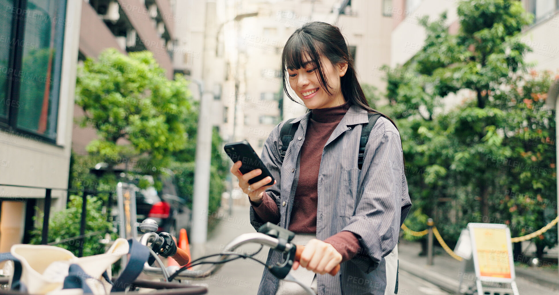 Buy stock photo Phone, bicycle and happy with Japanese woman in city for location, digital map and travel. Social media, cycling and mobile app with person and bike in Japan for networking, connection and adventure