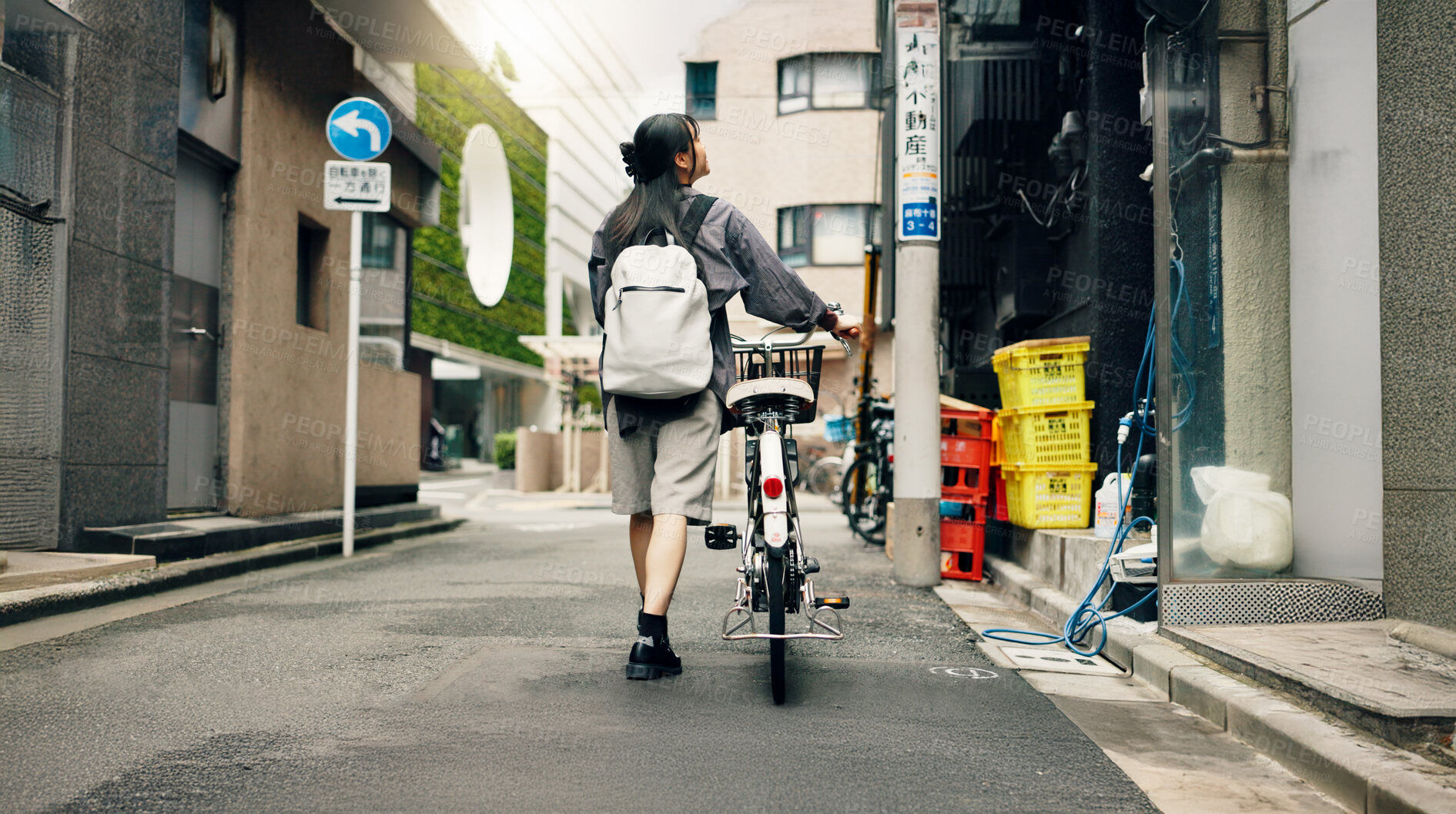 Buy stock photo Travel, walking and Asian woman with bicycle in city for commute to university, college and school. Student, cycling and person on bike for trip, sustainability and eco friendly transport in Japan