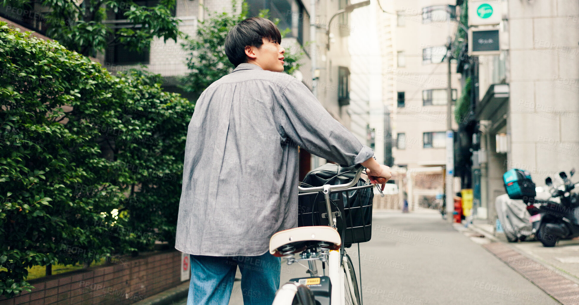 Buy stock photo Walking, city and back of Asian man with bicycle for commute to university, college and school. Travel, sightseeing and person on bike for trip, sustainability and eco friendly transport in Japan