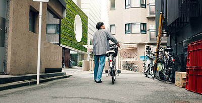 Buy stock photo City, walking and back of Asian man with bicycle for commute, journey and explore town on weekend. Travel, cycling and person on bike for trip, sustainability and eco friendly transport in Japan