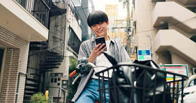 Buy stock photo Phone, bicycle and smile with Japanese man in city for location, digital map and travel. Social media, cycling and mobile app with person and bike in japan for networking, connection and adventure