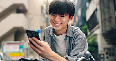 Buy stock photo Phone, search and laughing with Japanese man in city for location, digital map and travel. Social media post, communication and mobile app with person in Japan for meme, connection and adventure