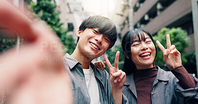 Buy stock photo Happy, asian couple and portrait with peace sign for selfie, photography or memory together in city street. Japanese, man and woman with smile for moment, capture or picture in an urban town in Tokyo