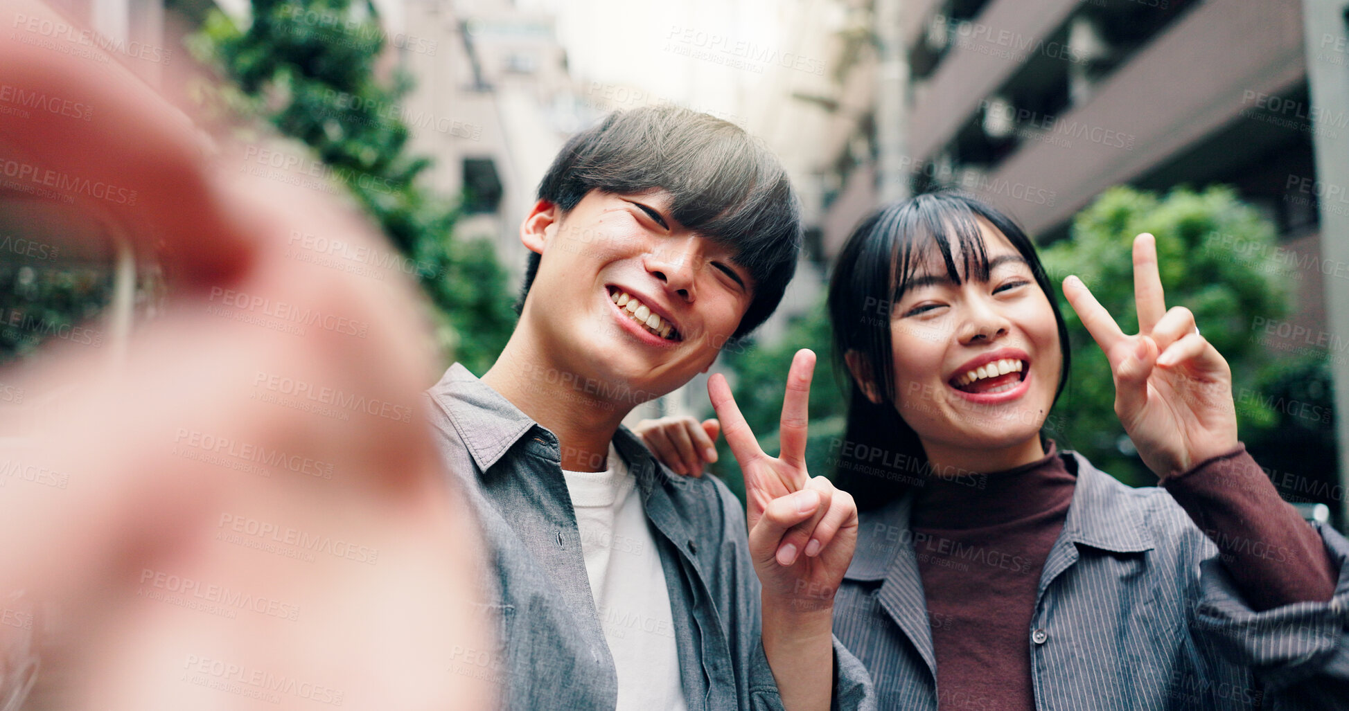 Buy stock photo Happy, asian couple and portrait with peace sign for selfie, photography or memory together in city street. Japanese, man and woman with smile for moment, capture or picture in an urban town in Tokyo