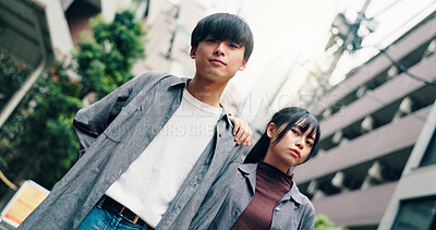 Buy stock photo Couple, portrait and fashion with attitude in street, confidence and travel together in city. Man, woman and clothes with partner, love or bonding for connection in low angle on urban road in Japan