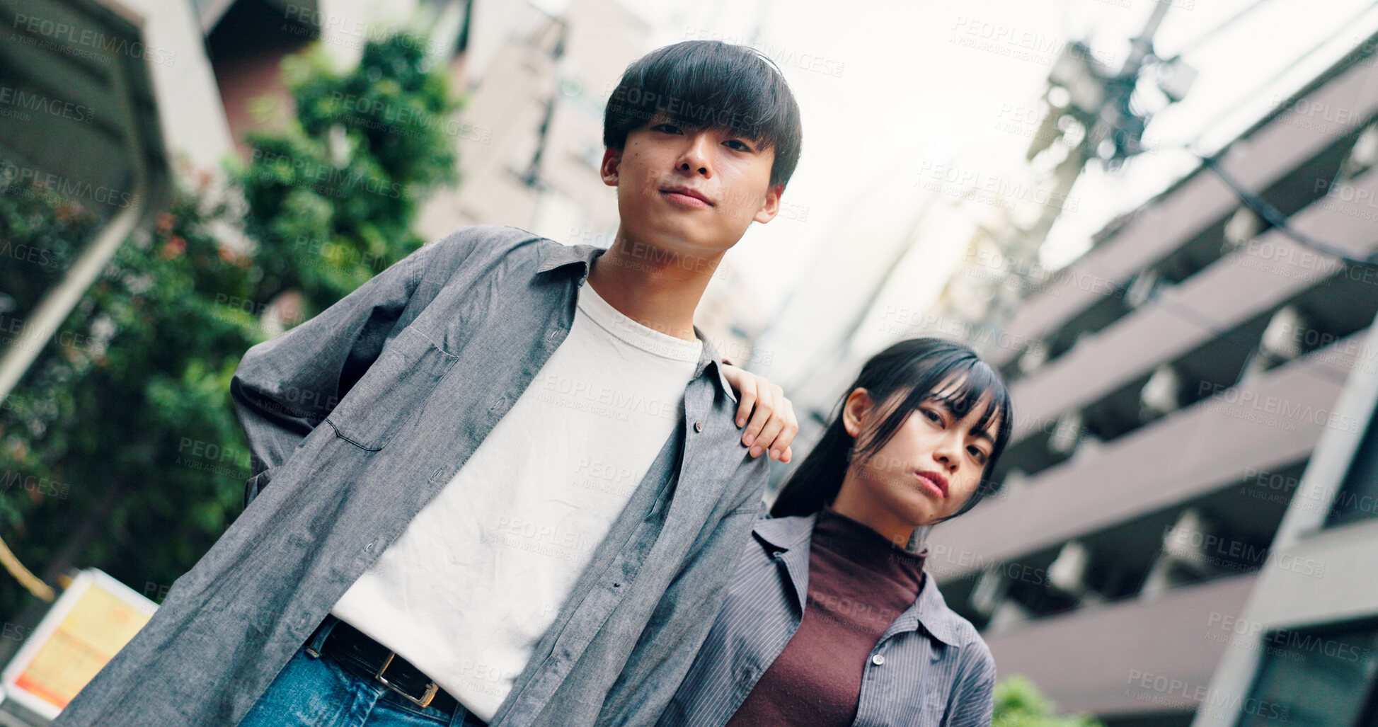 Buy stock photo Couple, portrait and fashion with attitude in street, confidence and travel together in city. Man, woman and clothes with partner, love or bonding for connection in low angle on urban road in Japan