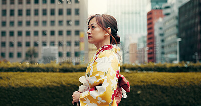 Buy stock photo Explore, walking and woman in city with kimono, morning commute and sightseeing in traditional clothes. Street, discover and girl with Japanese fashion, culture or weekend travel on urban adventure