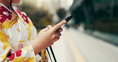 Buy stock photo Asian woman, hands and typing with phone in city for communication, online chatting or texting. Japan, closeup or female person with mobile smartphone in kimono for network or app in an urban town