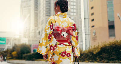 Buy stock photo Street, travel and woman in city with kimono, morning commute and sightseeing in traditional clothes from back. Explore, discover and girl with Japanese fashion, culture or walking on urban adventure