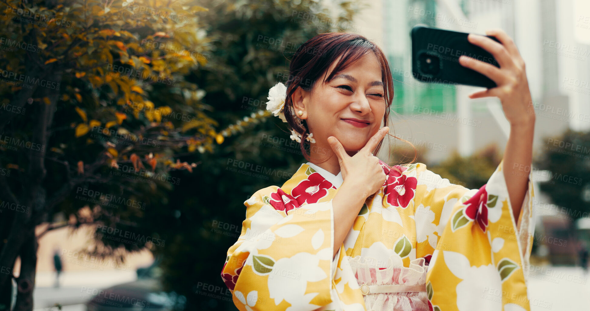 Buy stock photo Selfie, wink and kimono with Japanese woman in city for profile picture, memory and traditional clothes. Travel, social media post and content creator with person for heritage, culture and update