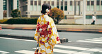 City, walking and woman on crosswalk with kimono, morning commute and sightseeing in traditional clothes. Explore, discover and girl with Japanese fashion, culture or urban street on travel adventure