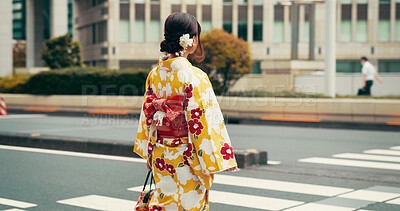 Buy stock photo City, walking and woman on crosswalk with kimono, morning commute and sightseeing in traditional clothes. Explore, discover and girl with Japanese fashion, culture or urban street on travel from back