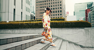 Buy stock photo City, walking and woman on steps with kimono, morning commute and sightseeing in traditional clothes. Explore, discover and girl with Japanese fashion, culture or urban stairs on travel adventure