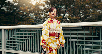 Buy stock photo Culture, kimono and thinking with Japanese woman in city for heritage, festival ceremony and fashion. Traditional clothes, reflection and respect with person and japan outdoor for pride and peace