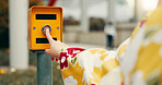 Woman, hand and city with traffic light for travel, pedestrian crossing or commute by street or road. Japan, closeup or tourist with button or kimono for safety, intersection or stop in an urban town