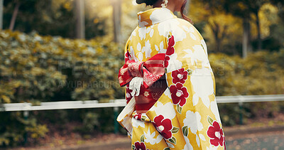 Buy stock photo Back, kimono and walking with Japanese woman in park for heritage, festival ceremony and culture. Traditional clothes, fashion and respect with asian person and obi bow for pride, travel and peace