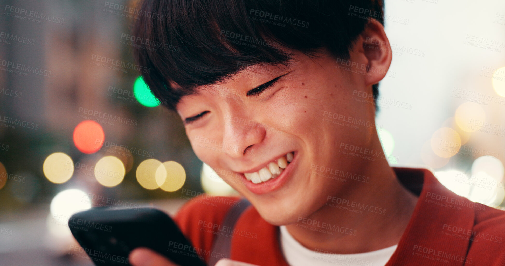 Buy stock photo Happy, phone and Asian man in city for social media, online message and internet in evening. Travel, networking and person on smartphone for website, notification and mobile app on weekend in Japan