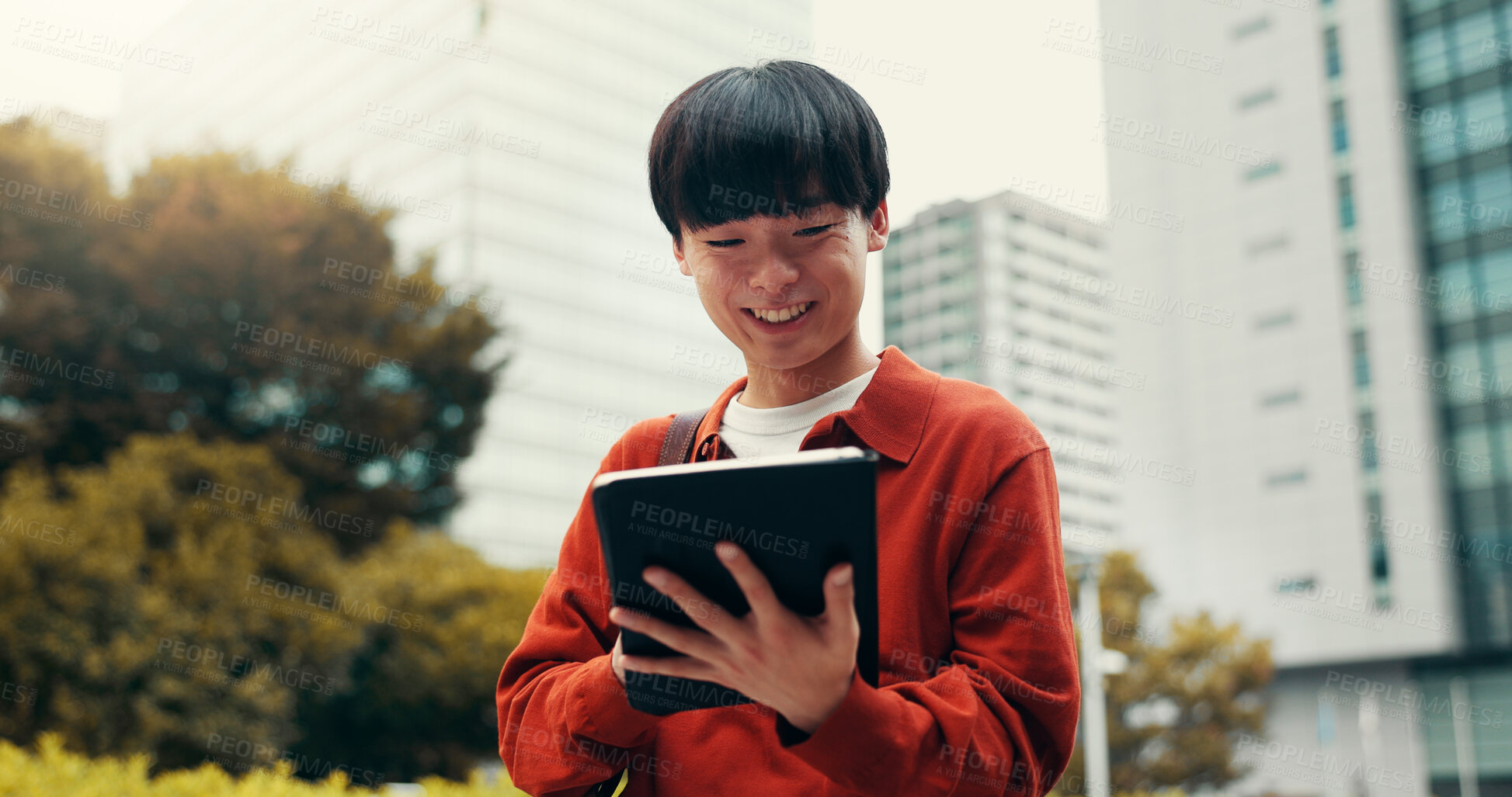 Buy stock photo Man, tablet and travel in street with smile, notification or reading with social media on commute in city. Person, touchscreen and scroll on app, contact or booking taxi on urban sidewalk in Japan