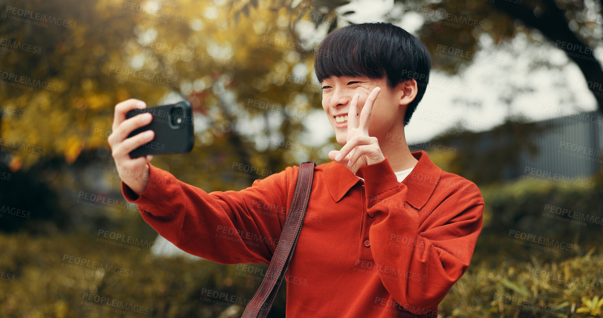 Buy stock photo Selfie, peace sign and man in park with social media, outdoor live streaming or online communication. Nature, photography and Japanese streamer with content creation, networking or web connectivity