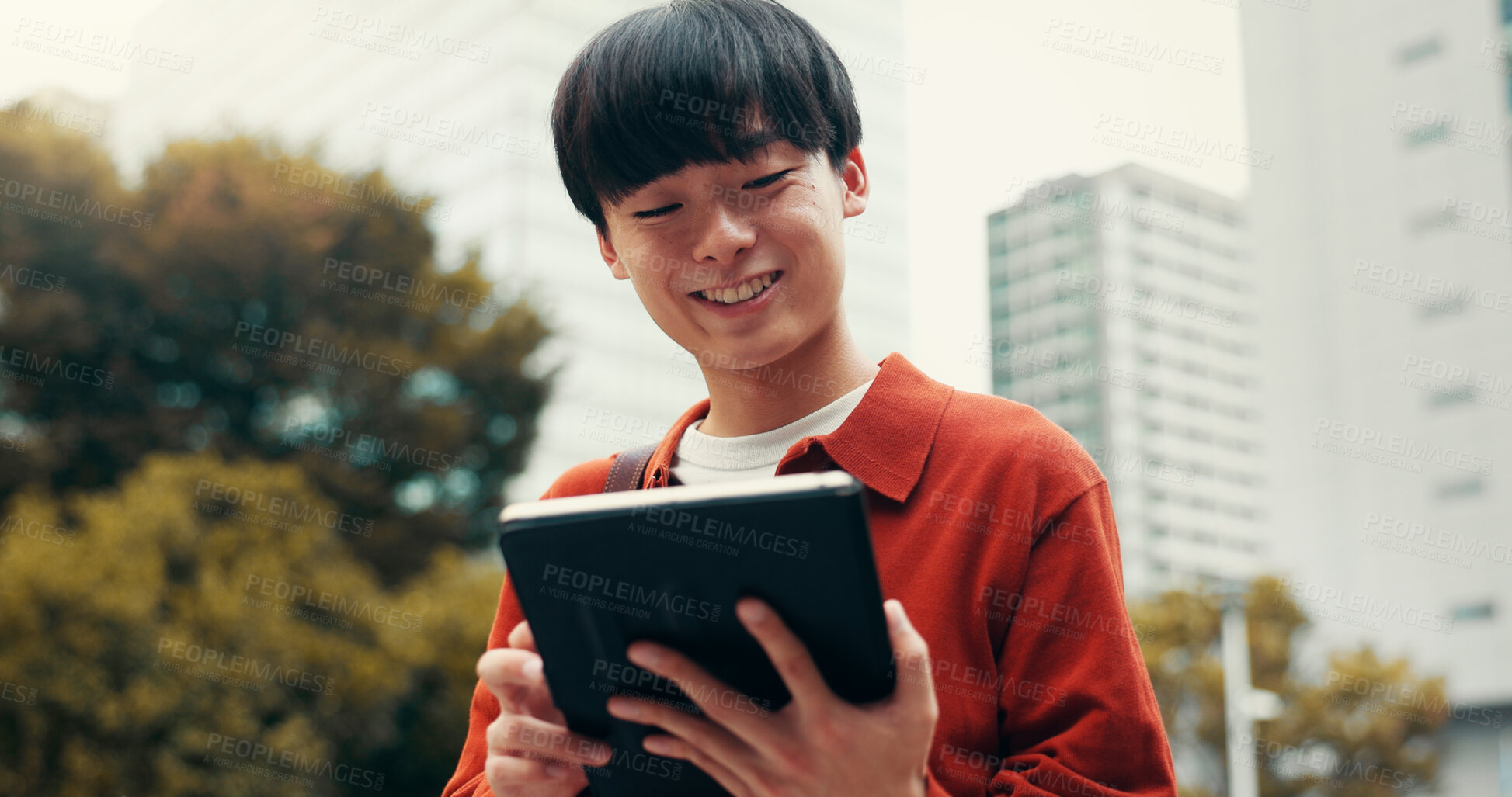 Buy stock photo Man, tablet and happy for travel in street, notification and reading with social media on commute in city. Person, touchscreen and scroll on app, contact or booking taxi on urban sidewalk in Japan