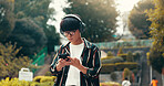 Man, headphones and student travel with phone in nature, streaming playlist and online for message. Male person, university campus and hearing sound on journey in Japan, typing and college email