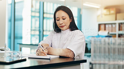 Buy stock photo Science, woman and notebook with writing in lab for research notes, results and learning for exam. Japanese medical university, student and findings report for experiment review and scientific study